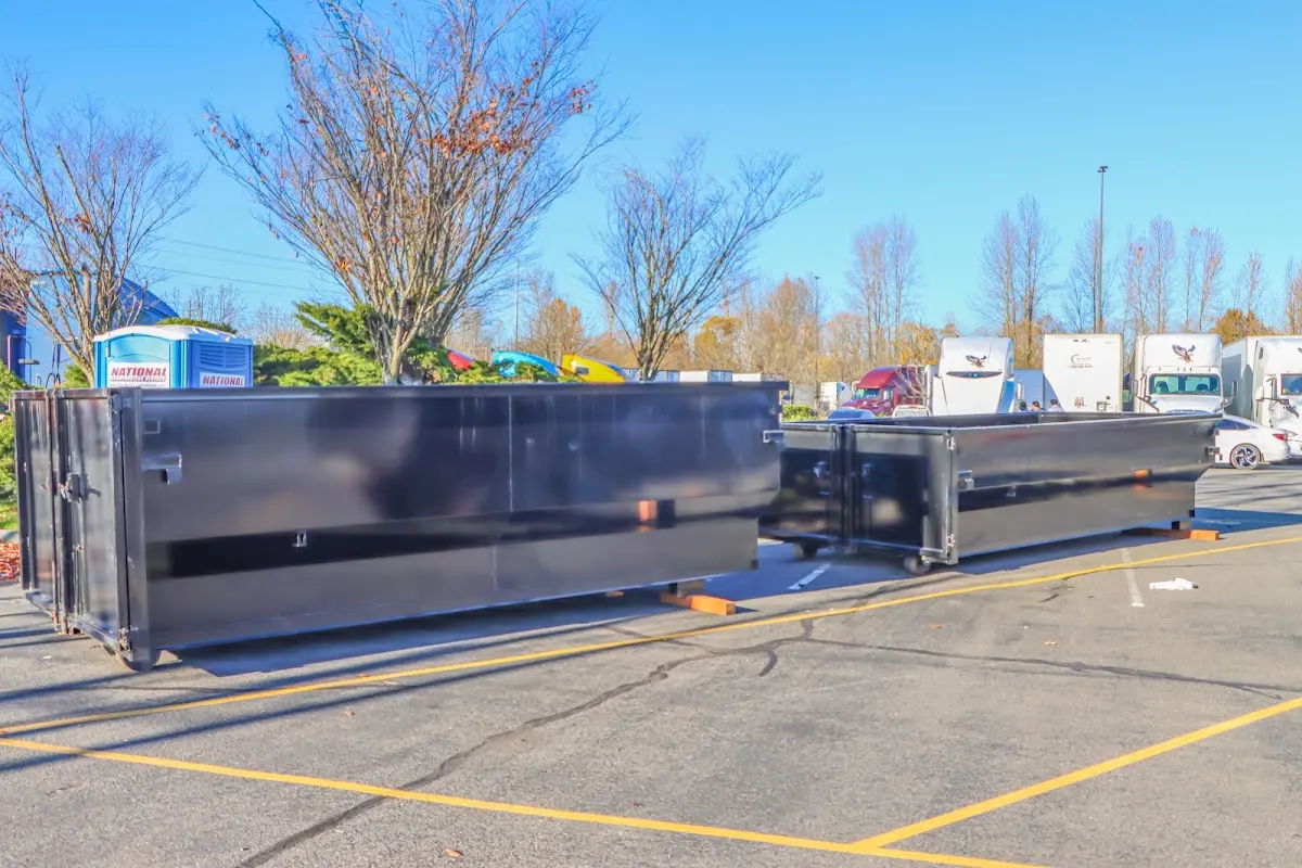 Professional dumpster rental service with roll-off container on residential driveway in Palmer Ranch